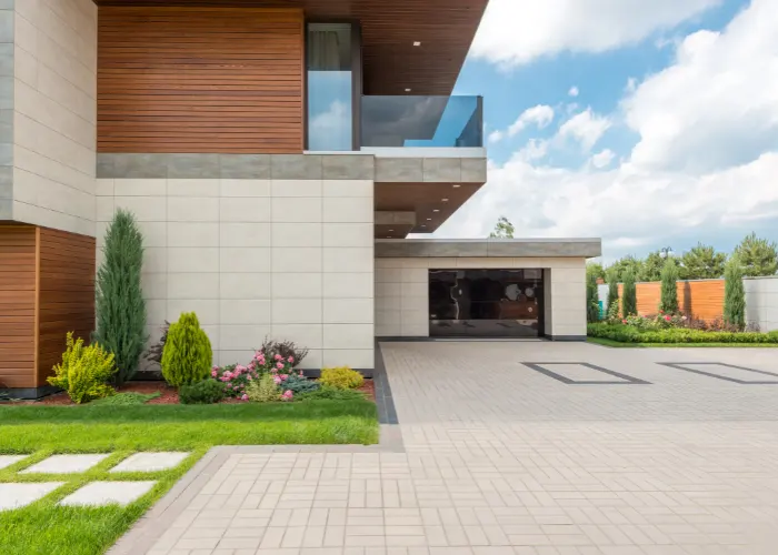 Modern house with a concrete driveway with rectangle designs in it
