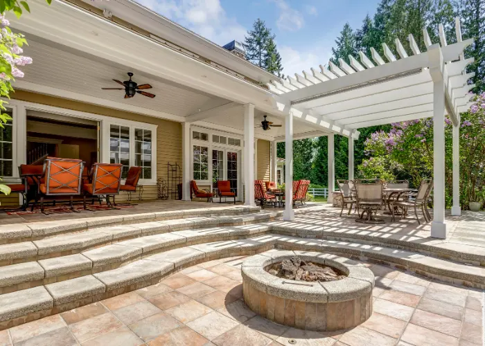 Beautiful patio with steps leading down to a  decorative concrete patio